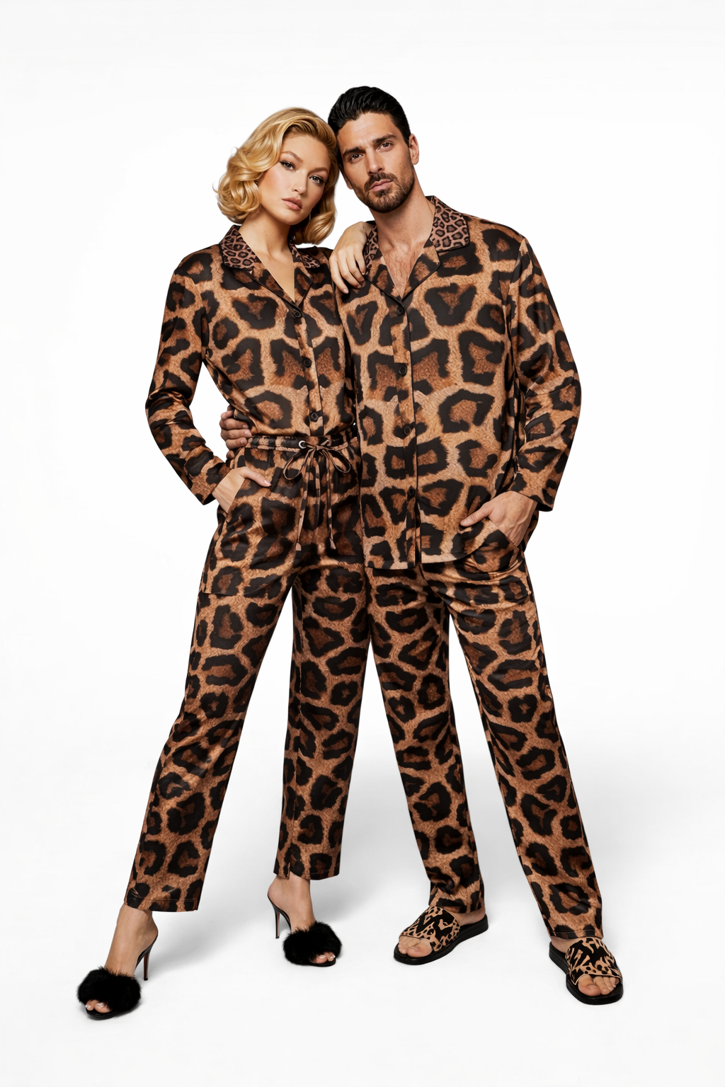 Two people wearing matching leopard print outfits on a white background